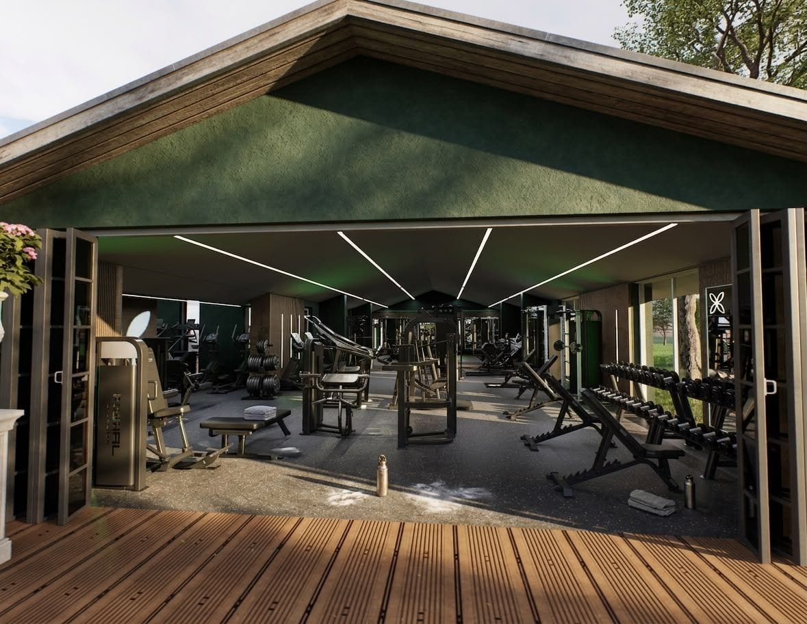 The gym seen from the deck through the full-height bifold doors