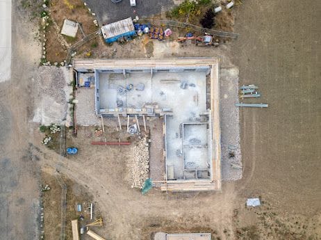 Top-down aerial of the L-shaped Breeze building footprint